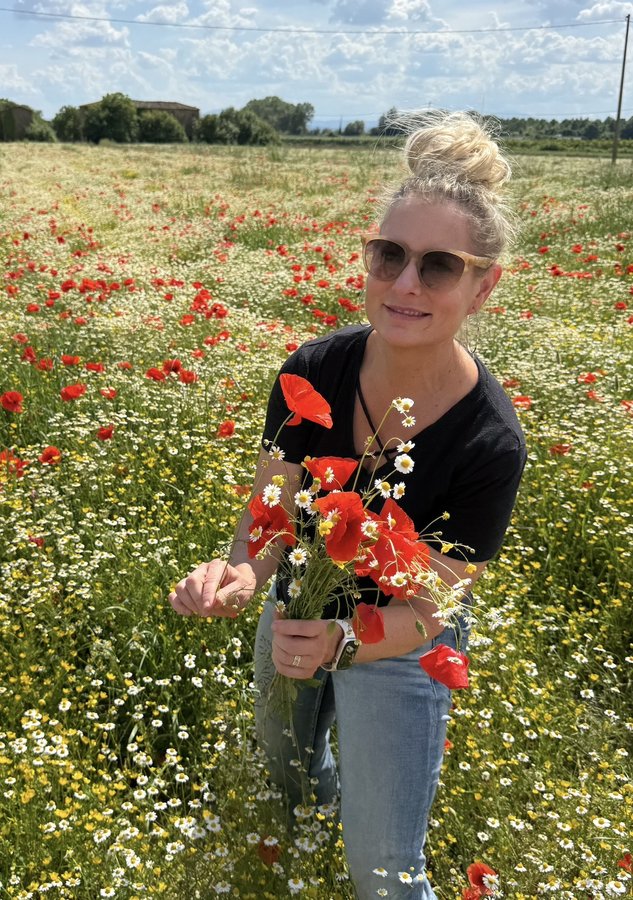 Jennifer Vranes in a poppy field